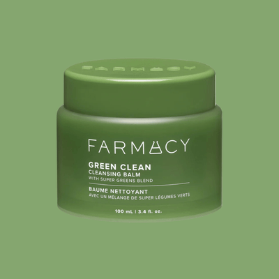 Green cleansing balm jar close up with smooth balm texture