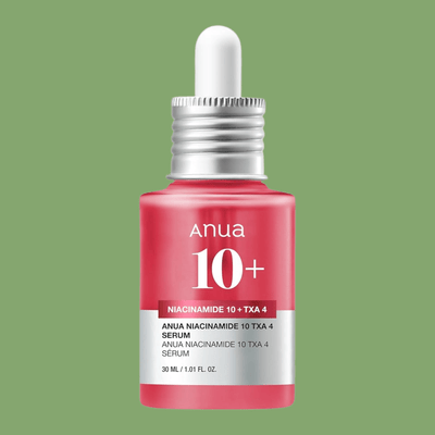 Olivine Beauty dark spot correcting serum bottle with niacinamide and tranexamic acid formula.
