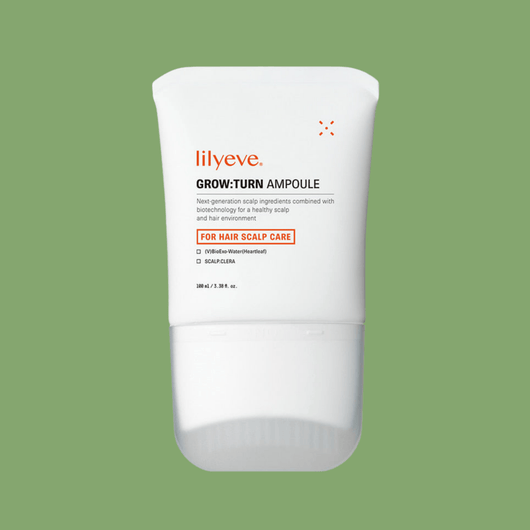 Minimalist white bottle of hair growth serum with clear label and scalp care formula