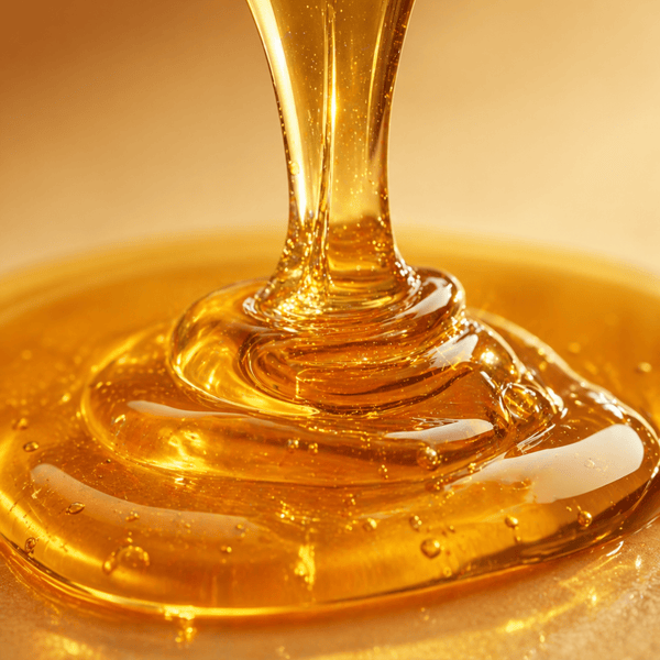 golden honey dripping representing skin hydration and softness