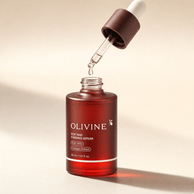 Dropper releasing a drop of NAD+ EGF Firming Serum