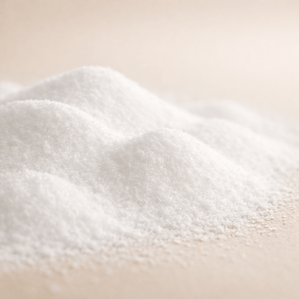 Pure white niacinamide powder ingredient by Olivine Beauty on beige spa background