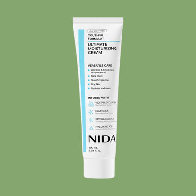 NIDA Ultimate Moisturizing Cream tube on soft green skincare background