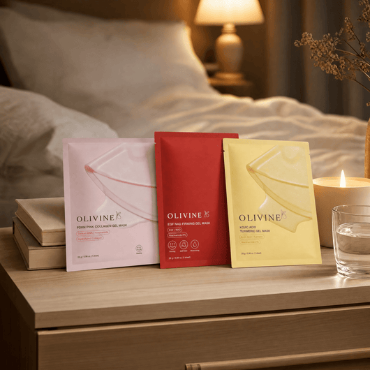 Olivine Beauty Overnight Glow Jelly Mask trio on a bedside table beside a candle