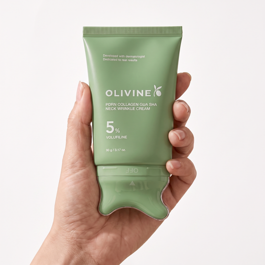 Hand holding the green Olivine Beauty PDRN Collagen Gua Sha Neck Wrinkle Cream to show its size