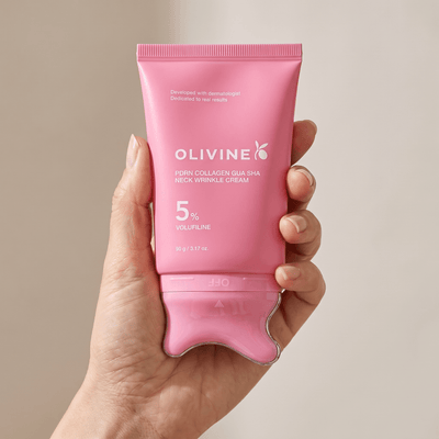 Hand holding the Olivine Beauty PDRN Collagen Gua Sha Neck Wrinkle Cream to show its size