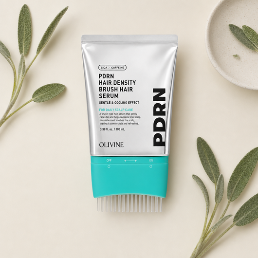 PDRN Hair Density Brush Serum laid flat beside fresh green sprigs