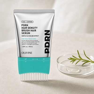 PDRN Hair Density Brush Serum beside a rosemary sprig in a glass dish