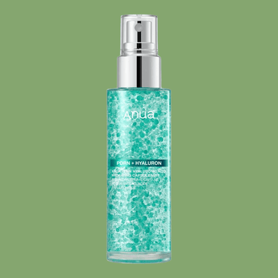 Transparent aqua skincare mist bottle with suspended hydration capsules and silver spray cap.