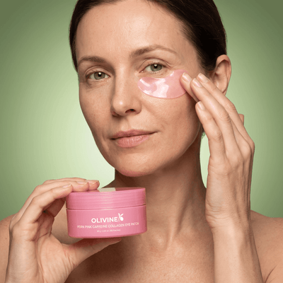 Woman applying an Olivine Beauty PDRN Pink Caffeine Collagen Eye Patch under her eye