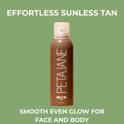 Olivine Beauty Self-Tanning Mist bottle for effortless sunless tan on a sage green background.