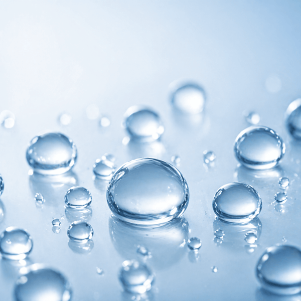 Hydrating droplets representing sodium hyaluronate for plump skin