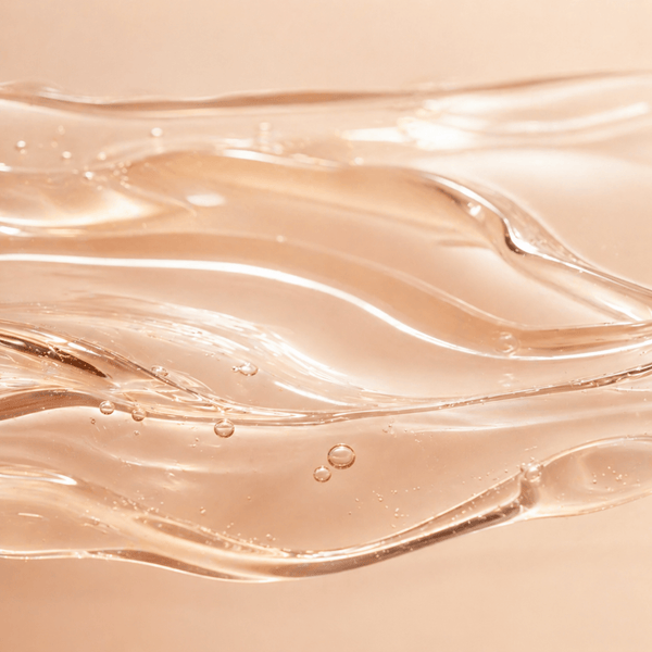 Smooth flowing liquid layers representing tranexamic acid for improving uneven skin tone and discoloration