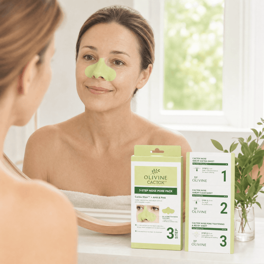 Olivine Cactox 3 Step Nose Mask Pack held by a woman with glowing skin