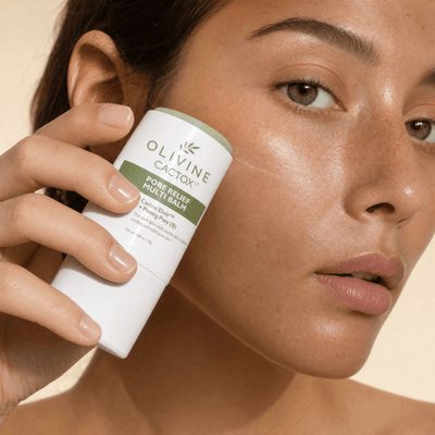Olivine Cactox Pore Relief Multi Balm held in hand, close up
