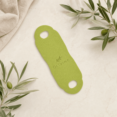 Olivine Cactox V Lifting Mewing Band flat lay on a cream background