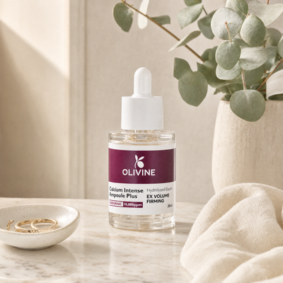 Olivine Calcium Intense Ampoule Plus on a bright bathroom vanity