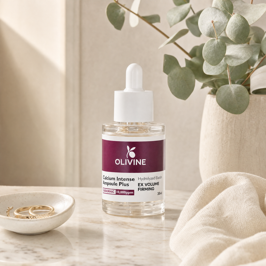 Olivine Calcium Intense Ampoule Plus on a bright bathroom vanity