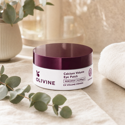 Olivine Calcium Volume Eye Patch on a bright bathroom vanity