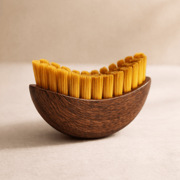 Side profile of Olivine contour face brush showing curved ergonomic shape for jawline and cheek sculpting
