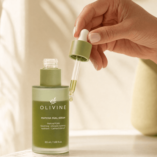 Olivine Matcha Dual PDRN Serum held in hand, close up