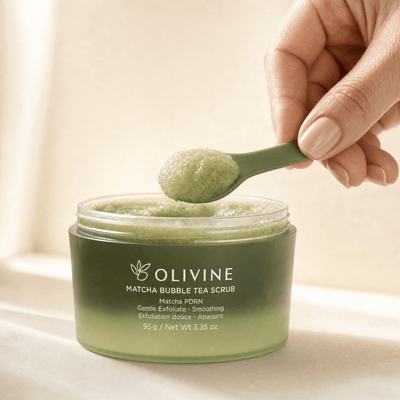 Olivine Matcha PDRN Bubble Tea Scrub held in hand, close up