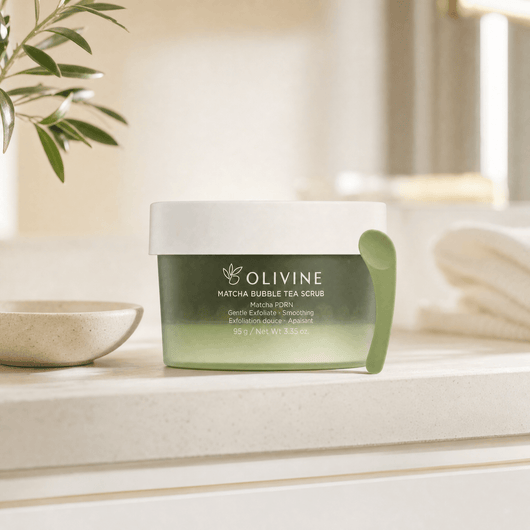 Olivine Matcha PDRN Bubble Tea Scrub in a bright bathroom vanity setting