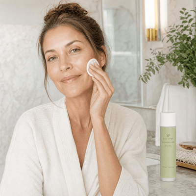 Olivine Matcha PDRN Skin Toner held by a woman with glowing skin