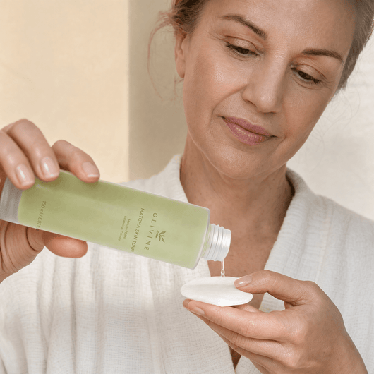 Olivine Matcha PDRN Skin Toner held in hand, close up