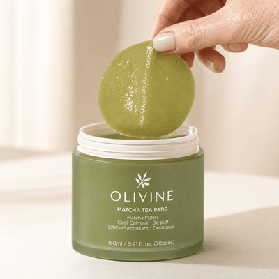Olivine Matcha PDRN Tea Pad held in hand, close up