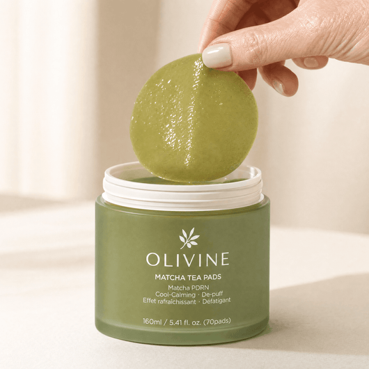 Olivine Matcha PDRN Tea Pad held in hand, close up