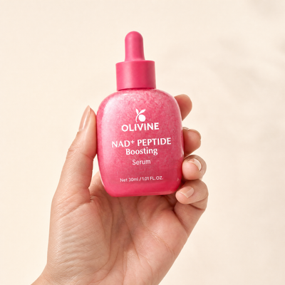 Olivine NAD Plus Peptide Serum held in hand, close up