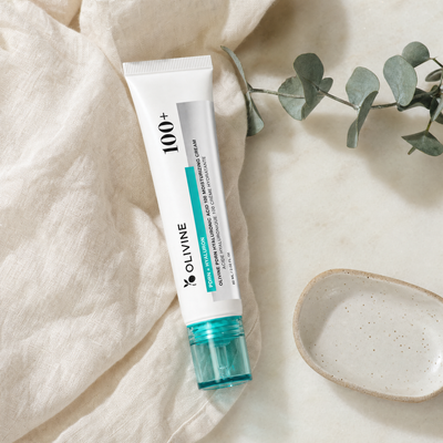 Olivine PDRN Hyaluronic Acid Cream on a bright bathroom vanity