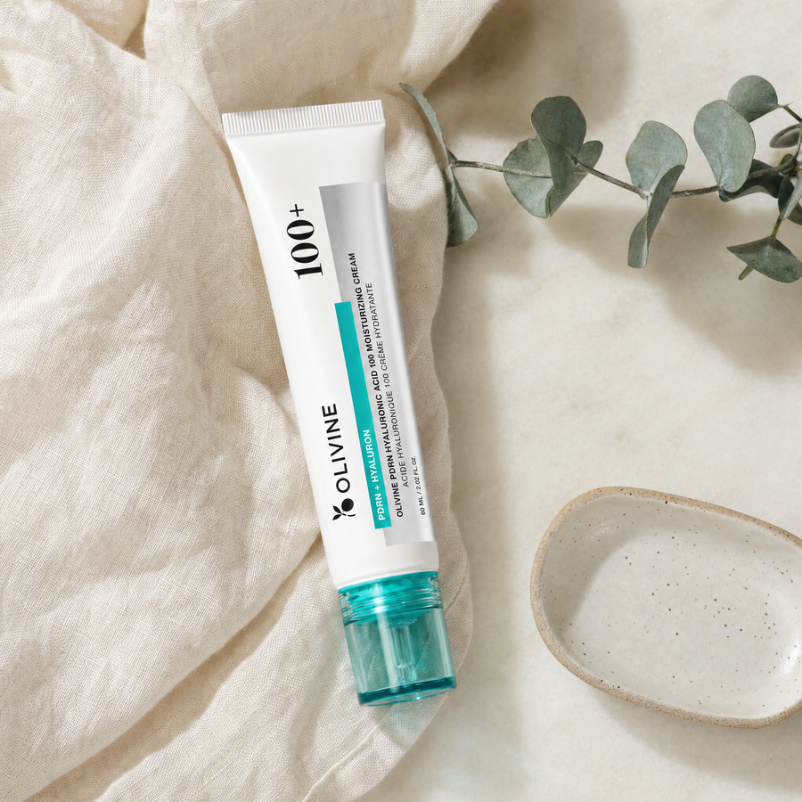 Olivine PDRN Hyaluronic Acid Cream on a bright bathroom vanity