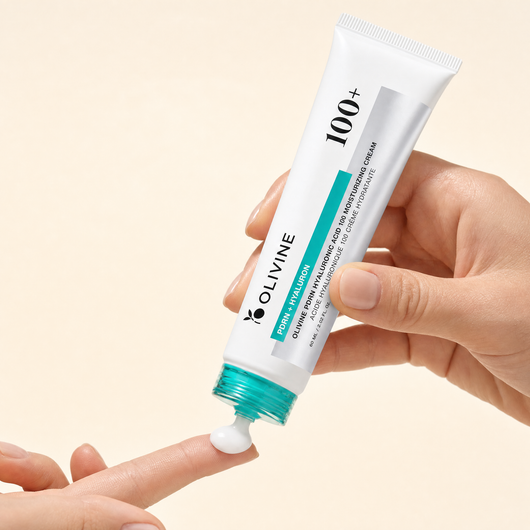 Olivine PDRN Hyaluronic Acid Cream being squeezed from the tube, close up