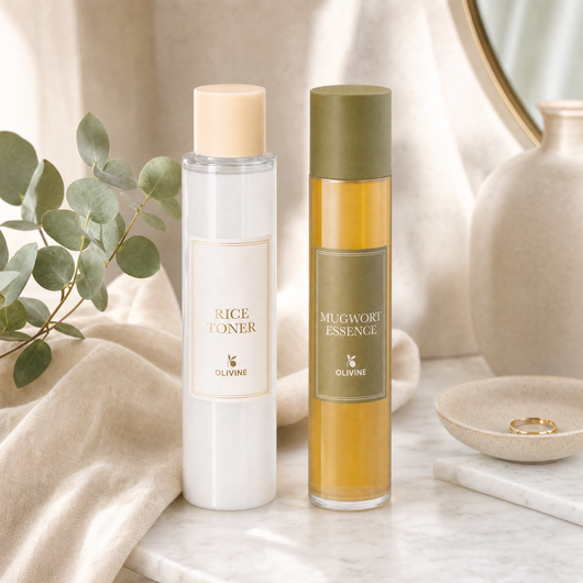 Olivine Skin Flooding Duo Rice Toner and Mugwort Essence on a bright bathroom vanity