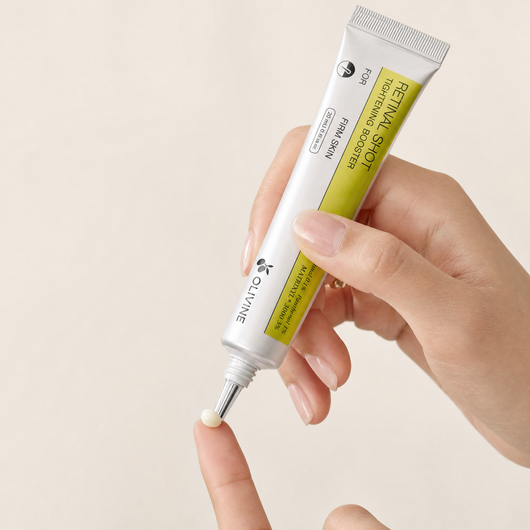 Olivine Vita A Retinal Shot Tightening Booster being squeezed, close up